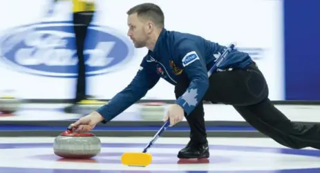  ?? ADRIAN WYLD/THE CANADIAN PRESS ?? Skip Brad Gushue throws a stone during Olympic curling trials action Monday against John Morris’ team. Gushue upped his record to 2-1 with the win.