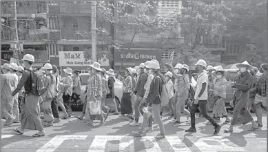  ??  ?? YAONGON
People take part in a rally against the military coup.
-REUTERS