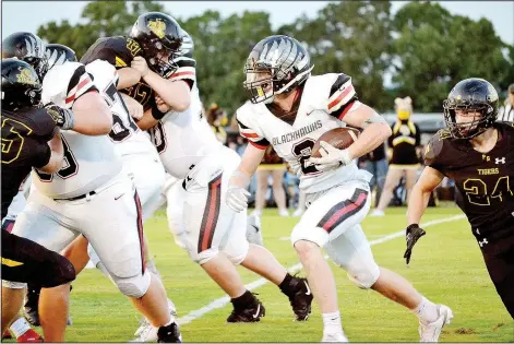  ??  ?? Blackhawk junior Joe Adams (2) put on a good show Friday in Prairie Grove, running against a very good Tiger rushing defense and carrying the ball 20 times for 70 yards. Adams also scored the game’s first touchdown.
(NWA Democrat-Gazette/Annette Beard)