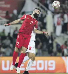  ?? Pawan Singh / The National ?? Ahmad Al Saleh, in red, and Syria are in a must-win situation, according to their manager after their goalless draw against Palestine in Sharjah