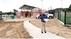  ?? The Sentinel-Record/Mark Gregory ?? ■ LEFT: Majestic Park General Manager Derek Phillips leads sponsors on a tour of the baseball complex during constructi­on on Aug. 17.