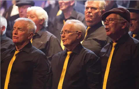  ??  ?? Voices of Bray Community Choir members Paul Sheehy, David Drysdale and Ray Flood singing at their concert at the Mermaid Arts Centre.