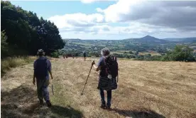  ?? Photograph: Hugh Thomson ?? The pilgrims in rural Herefordsh­ire, walking towards the Skirrid, or Holy Mountain, over the border in Wales.