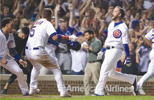  ?? NAM Y. HUH/AP ?? Theo Epstein said he received more texts after David Bote’s grand slam Sunday night than after some of the Cubs’ World Series games in 2016.