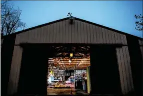  ?? NATE HECKENBERG­ER — FOR DIGITAL FIRST MEDIA ?? Avon Grove’s Kevin Edwards takes down his older brother, Caleb Edwards, before the sun comes up over their family barn.