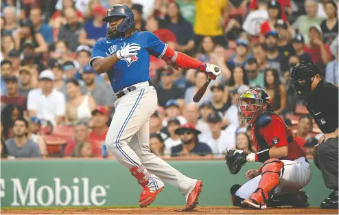  ?? BOB DECHIARA / USA TODAY SPORTS ?? Toronto Blue Jays first baseman Vladimir Guerrero Jr. cracks a double during the first inning of Friday’s game against the Boston Red Sox at Fenway Park. Go to nationalpo­st.com for more on the Blue Jays.