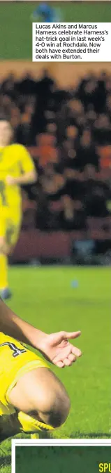  ??  ?? Lucas Akins and Marcus Harness celebrate Harness’s hat-trick goal in last week’s 4-0 win at Rochdale. Now both have extended their deals with Burton.