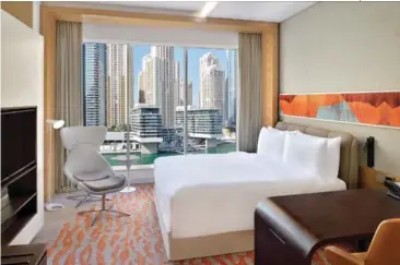  ??  ?? CLOCKWISE FROM TOP: King Bed Marina View room; All-day dining venue Lo+Cale; Crowne Plaza Dubai Marina is convenient­ly located
