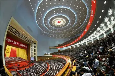 ?? — Reuters ?? Good news: Delegates attending the opening of the 19th National Congress of the Communist Party of China in Beijing.