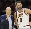  ?? TONY DEJAK — THE ASSOCIATED PRESS ?? John Beilein, left, talks with Kevin Love during the first half of a preseason game against San Lorenzo on Oct. 7.