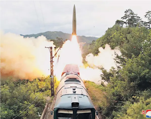  ??  ?? The ballistic missile was fired from a railway carriage in the mountainou­s central area of North Korea at dawn on Wednesday. It struck a sea target some 500 miles away