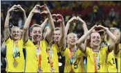  ?? TERTIUS PICKARD — THE ASSOCIATED PRESS ?? Sweden players celebrate with their bronze medals after beating Australia in the Women's World Cup third-place game.