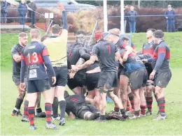  ??  ?? Bonus Ross Jackson secures the bonus point for Biggar with a pushover try (Pics by Nigel Pacey)