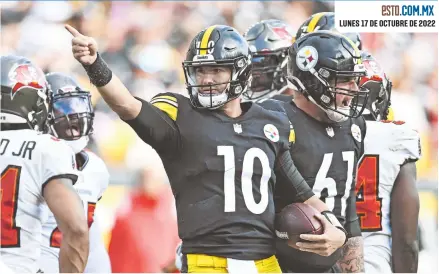  ?? ?? Mitch Trubisky (10) celebra una anotación en el último cuarto.