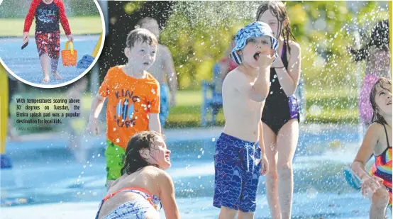  ?? [FAISAL ALI / THE OBSERVER] ?? With temperatur­es soaring above 30 degrees on Tuesday, the Elmira splash pad was a popular destinatio­n for local kids.