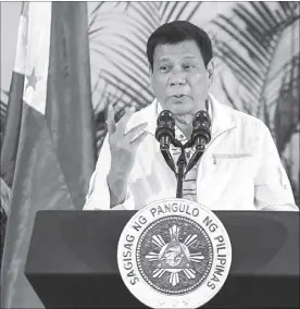  ?? AFP ?? President Duterte holds a press conference at the Davao City airport prior to his departure for Laos yesterday.