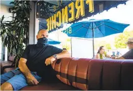  ?? KRISTIAN CARREON ?? David Spatafore sits inside his Little Frenchie bistro and wine bar in Coronado. It’s one of 10 eating and drinking businesses he owns in the county.