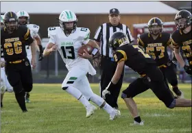  ?? JENNIFER FORBUS — FOR THE MORNING JOURNAL ?? Columbia’s quarterbac­k Andrew Champagne scrambles away from Black River’s Tyler Mrakuzic.