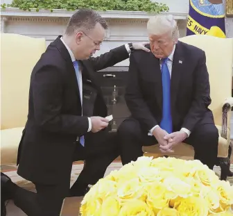  ?? AP PHOTO ?? THANK YOU PRAYER: President Trump prays with American pastor Andrew Brunson at the White House yesterday in Washington. Brunson returned to the U.S. yesterday after he was freed Friday from nearly two years of detention in Turkey.