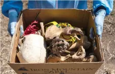  ?? ?? A partial skeleton is seen packed in a box at a mock crime scene during the practical exam of a Psychologi­cal Motivated Crimes course.