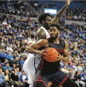  ?? DAVID JABLONSKI PHOTOS / STAFF ?? Dayton’s Josh Cunningham looks for a shot against Saint Louis on Tuesday at Chaifetz Arena in St. Louis.