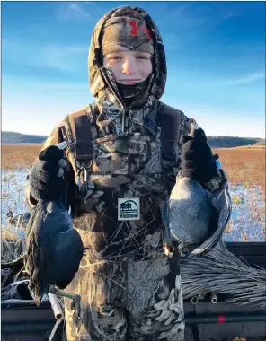  ?? PHOTO COURTESY OF JERRY HOLDEN ?? Eleven-year-old Tanner Holden of Benton holds a brace of coots that will eventually grace his family’s dinner table.