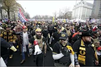  ?? LUIS M. ALVAREZ - THE ASSOCIATED PRESS ?? Supporters of President Donald Trump who are wearing attire associated with the Proud Boys attend a rally at Freedom Plaza, Saturday, Dec. 12, in Washington.