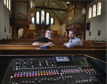  ??  ?? John the Evangelist Anglican Church has installed a $20,000 sound system and built a stage in order to host regular concerts. Here, Rev. David Anderson sits in the church’s sanctuary with parishione­r Steven McKay who helped with the installati­on.