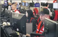  ?? JEFF CHIU — THE ASSOCIATED PRESS ?? Pacific Gas & Electric employees work in the PG& E Emergency Operations Center in San Francisco in October 2019.