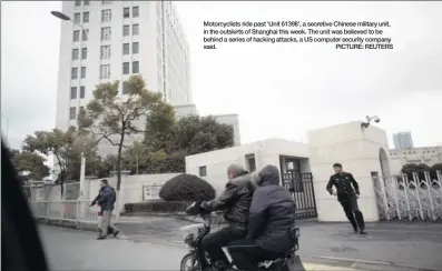  ??  ?? Motorcycli­sts ride past ‘Unit 61398’, a secretive Chinese military unit, in the outskirts of Shanghai this week. The unit was believed to be behind a series of hacking attacks, a US computer security company said. PICTURE: REUTERS