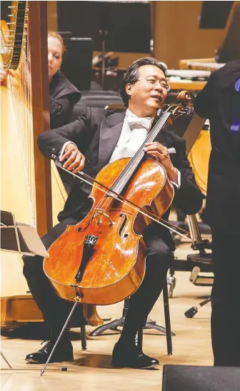  ?? DALE WILCOX ?? Yo-Yo Ma thrilled fans with the Toronto Symphony Orchestra in 2012. For now, performing together this closely is on hold.