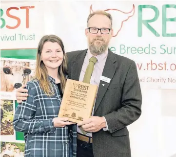  ?? ?? WINNER: Champion of the year Alice Lennox with RBST chairman John Atkinson.