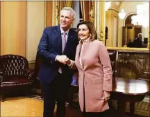  ?? Jabin Botsford / The Washington Post ?? Rep. Kevin McCarthy (R-Calif.) greets former House Speaker Nancy Pelosi (D-Calif.) after being elected speaker in 15 rounds of votes in a meeting of the 118th Congress at the U.S. Capitol.