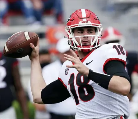  ?? JOHN BAZEMORE - THE ASSOCIATED PRESS ?? FILE - In this April 17, 2021, file photo, Georgia quarterbac­k JT Daniels (18) throws a pass during their spring NCAA college football spring game in Athens, Ga.. The Bulldogs are predicted to meet, and beat, Oklahoma in the National Championsh­ip game.