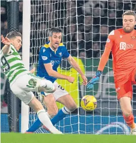  ?? ?? St Johnstone keeper Zander Clark tries to block Forrest’s strike, to no avail and the Celtic star notches the game’s only goal