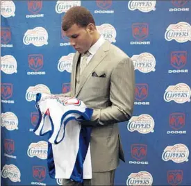  ?? GenaroMoli­na Los Angeles Times ?? THE CLIPPERS WOUND UP with the No. 1 pick in the 2009 draft after finishing with a 19-63 record. They used it on Oklahoma’s Blake Griffin, above, and that has turned out pretty well. The 21-61 Lakers hope things go their way Tuesday.