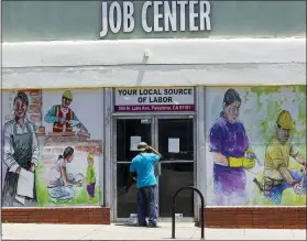  ?? THE ASSOCIATED PRESS ?? A person looks inside the closed doors of the Pasadena Community Job Center in Pasadena, Calif., during the coronaviru­s outbreak. California’s unemployme­nt rate continued to climb in May, reaching 16.3% as businesses continued to lay people off because of a state-at-home order aimed at slowing the spread of the coronaviru­s that has wrecked the state’s economy.