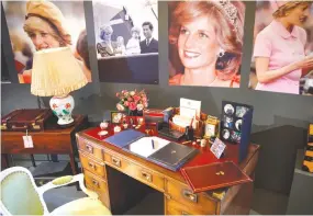  ??  ?? THE DESK at which Britain’s Diana, Princess of Wales, worked at whilst in residence at Kensington Palace, along with a selection of her personal artefacts, chosen by her sons Britain’s Prince William, Duke of Cambridge, and Britain’s Prince Harry, is...