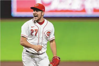  ?? AARON DOSTER/ASSOCIATED PRESS FILE ?? Trevor Bauer, who won the NL Cy Young Award while with the Cincinnati Reds last season, will be returning home to play for the Los Angeles Dodgers this season.