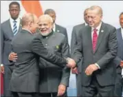  ?? AP ?? Russian president Vladimir Putin greets Turkey's President Recep Tayyip Erdogan (right) and Prime Minister Narendra Modi (centre) at the BRICS summit meeting in Johannesbu­rg on Friday.