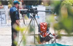  ??  ?? KEEN EYE: Snipers watch for crocs as divers search Moody Creek.