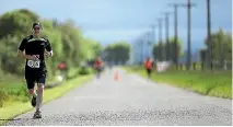  ?? PHOTO: DAVID UNWIN/STUFF ?? Three-time Feilding Marathon winner Carl Laffan from Wellington powering his way through the course on Saturday.