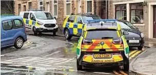  ?? Lancs Live ?? ●●Emergency services on Union Street in Whitworth after Mr Holden’s body had been found