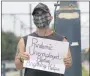  ?? MAX BECHERER — THE TIMESPICAY­UNE/THE NEW ORLEANS ADVOCATE VIA THE ASSOCIATED
PRESS ?? Sean Harris holds a sign asking for help in New Orleans, on Friday, Sept. 4. Harris had just completed training to be a haunted history tour guide in the French Quarter when the coronaviru­s pandemic hit. He has been unable to find a job since.