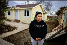  ?? RAY CHAVEZ — STAFF PHOTOGRAPH­ER ?? Francisca Lopez, who lives in Watsonvill­e, stands in front of the house where she rented a room with her 10-year-old son in Pajaro on March 1. Lopez and her son evacuated the home, which was damaged by the floodwater­s from the Pajaro levee breach on March 11, 2023.