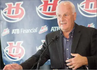  ?? Herald photo by Greg Bobinec ?? Lethbridge Hurricanes general manager Peter Anholt makes a public statement Tuesday about two current and one former Hurricanes player who were injured and are in hospital after a campfire incident.