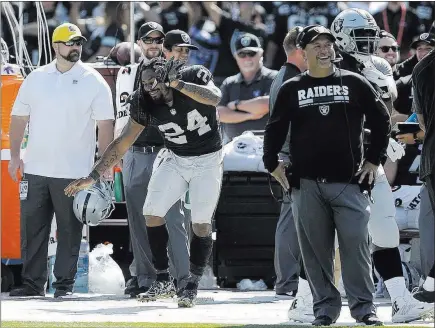  ?? Ben Margot ?? The Associated Press Raiders running back Marshawn Lynch dances on the sideline during the second half of a 45-20 victory over the New York Jets on
Sunday in Oakland, Calif. Lynch, an Oakland native, was playing his first regular-season game before...
