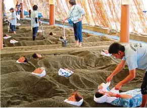  ??  ?? Ibusuki is famous for its sand baths, where visitors are buried in naturally heated sand.