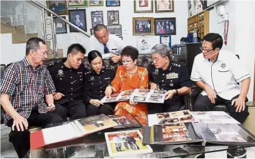  ??  ?? Police story: The family reminiscin­g over their years of service.