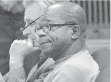  ??  ?? Tommy Ross Jr., right, sits with one of his lawyers during Ross’s first appearance in Clallam County Superior Court last November in connection with the 1978 homicide of Port Angeles resident Janet Bowcutt.